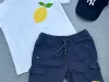 Kinder-T-Shirt in Weiß mit Zitronenmotiv.
